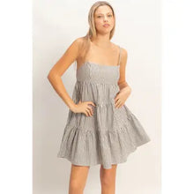 Load image into Gallery viewer, Woman wearing a striped dress against a plain background