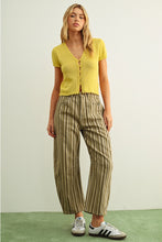 Load image into Gallery viewer, Woman wearing a yellow cardigan and striped pants against a plain background