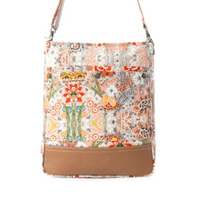 Load image into Gallery viewer, Floral patterned handbag with a strap on a plain background