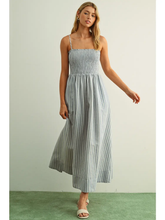 Load image into Gallery viewer, Woman wearing a striped dress against a plain background