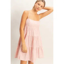 Load image into Gallery viewer, Woman wearing a pink tiered dress against a white background