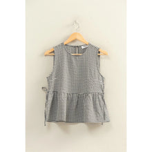 Load image into Gallery viewer, Black and white checkered dress on a hanger against a beige wall