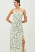 Load image into Gallery viewer, Woman wearing a green floral slip dress on a white background
