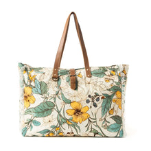 Load image into Gallery viewer, Floral patterned tote bag with brown straps on a white background
