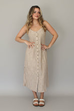 Load image into Gallery viewer, Woman wearing a beige dress with buttons on a plain background
