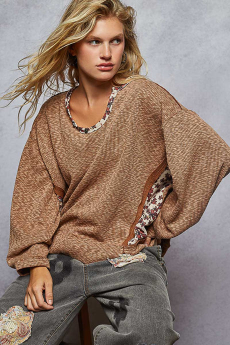 long sleeve oversized knit top with floral pattern contrast