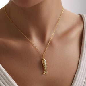 Gold chain with fish pendant