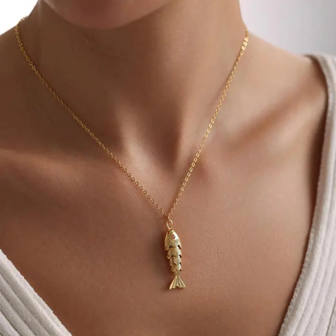 Gold chain with fish pendant