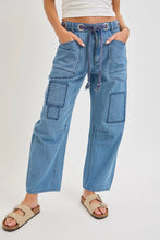 Load image into Gallery viewer, Blue patchwork pants worn by a person on a white background
